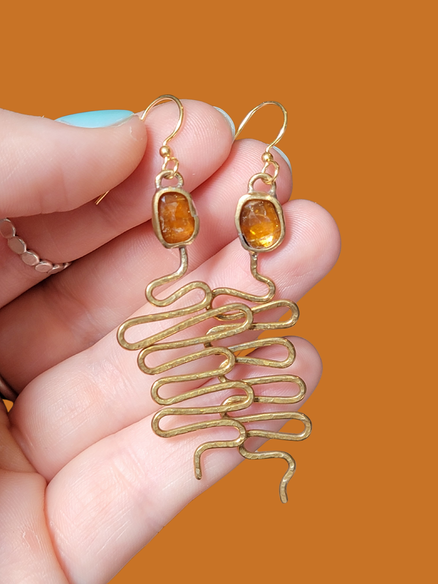 Orange kyanite snake earrings